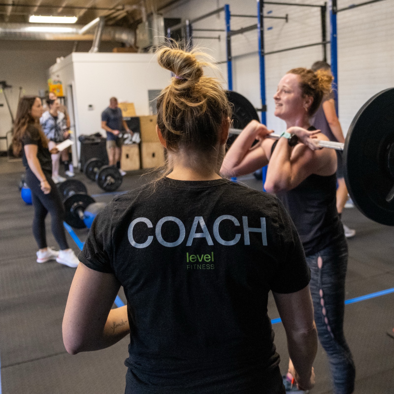 A coach watching over a class