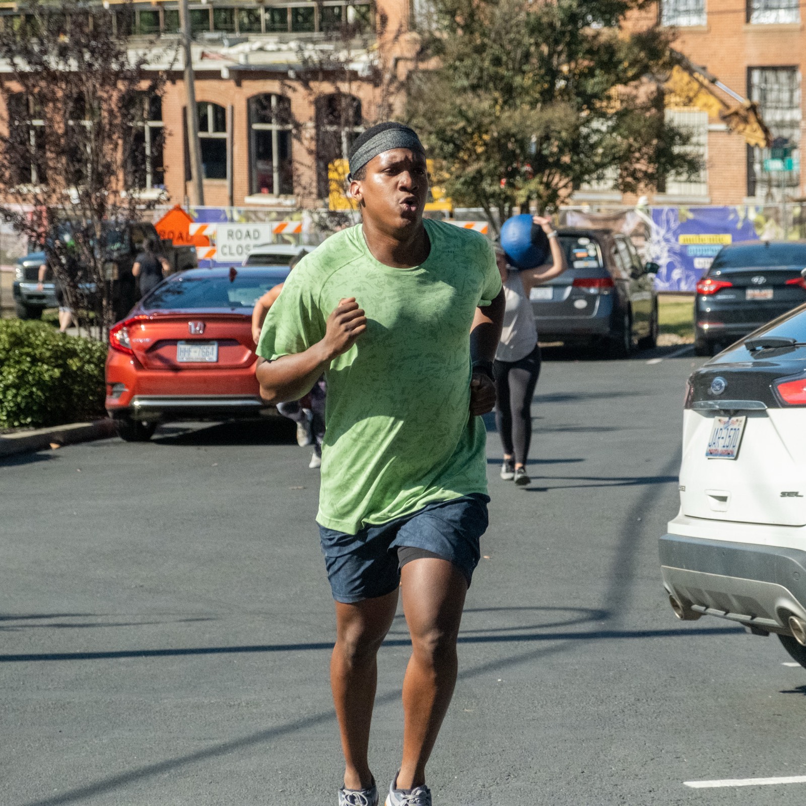 A member running outside the gym
