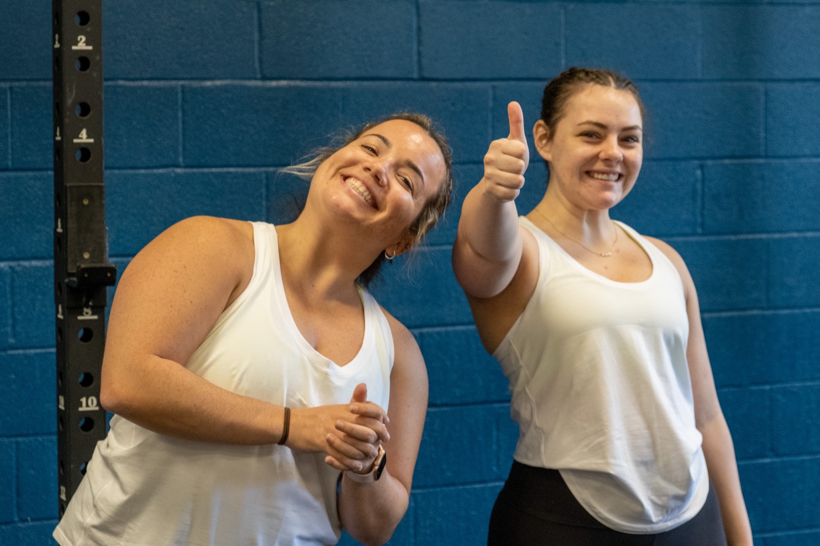 Two members giving a thumbs up