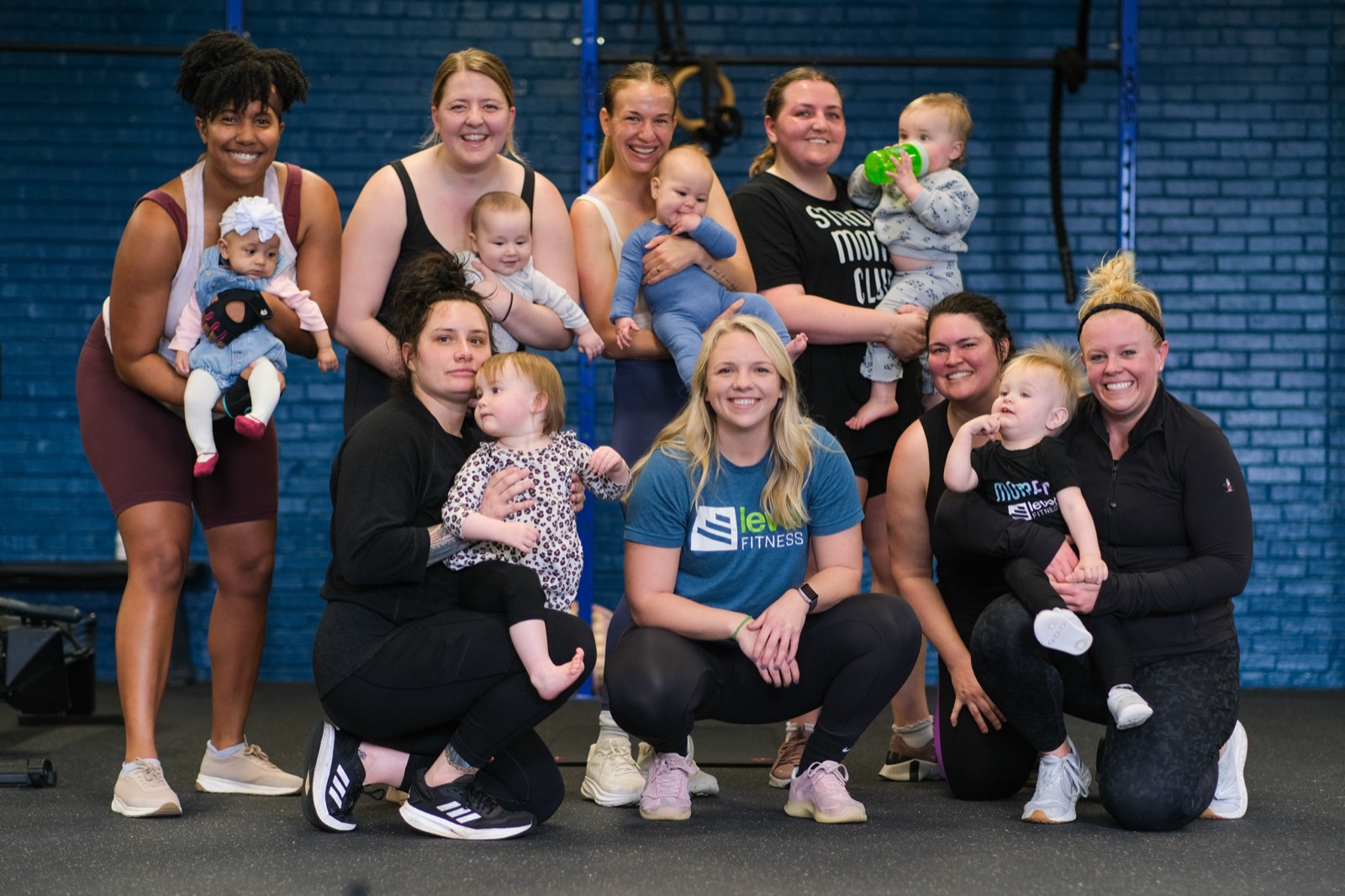 The full MomFit group with their babies at Level Fitness