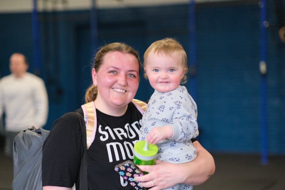 A MomFit member with her toddler